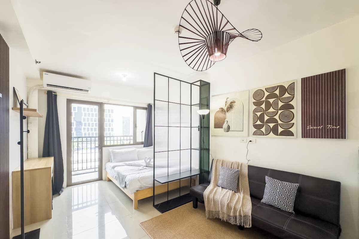 Premium Condo, 1 Queen Bed with Sofa bed, Balcony | Living area | 43-inch flat-screen TV with digital channels