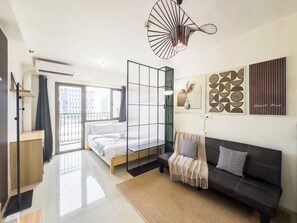 Premium Condo, 1 Queen Bed with Sofa bed, Balcony | Living area | 43-inch flat-screen TV with digital channels - GemstoneBR in SMDC Shore Residences (Pasay)