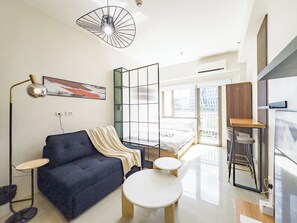 Deluxe Condo, Non Smoking, Balcony | Living area | 43-inch flat-screen TV with digital channels - GemstoneBR in SMDC Shore Residences (Pasay)