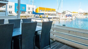 A waterfront restaurant with outdoor seating overlooking a marina. - Hliday Home on a Holiday Park in Ebeltoft (Ebeltoft)