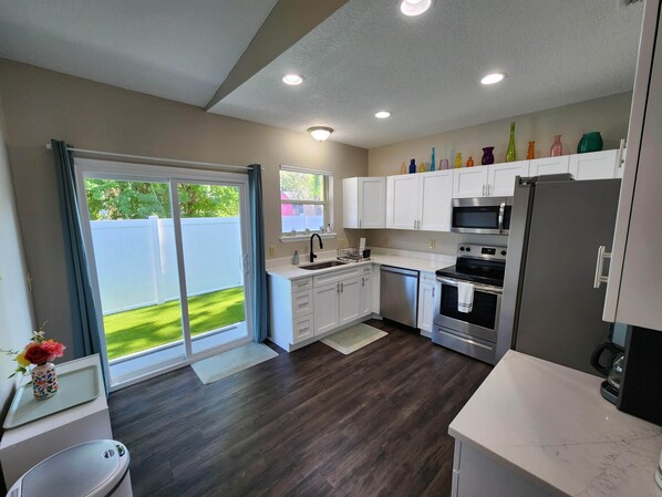 Fridge, microwave, oven, stovetop - Bright Family Beach Home | Across from Park/Playground | 4BR/2BA (Jacksonville Beach)