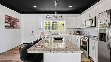 Coffee/tea maker, fridge, microwave, oven