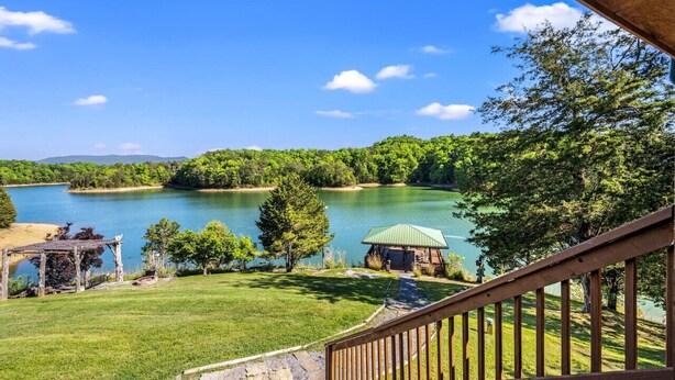 A lakeside view with a gazebo, a small cabin, and a wooden staircase. - Lakefront Mtn Retreat w Private Boat Dock & Launch (Sevierville)