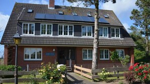 A two-story building with a sign reading "HAUS PAX" on the front. - 3 in Haus Pax Modern Retreat (Nebel)