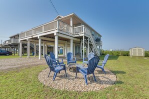 A two-story house with a balcony and a covered porch. - Walk to Shore: Surfside Beach Home w/ Bay Views (Freeport)