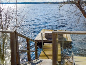 A wooden dock extending into a body of water with a clear sky above. - 5 Star Holiday Home in Hjaltevad (Hjältevad)