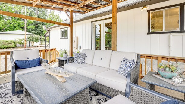 An outdoor patio with a sofa, chairs, and a table. - Sonoma County Vacation Rental w/ Vineyard Views! (Sebastopol)