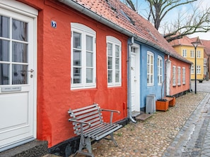 A row of colorful buildings with a cobblestone street. - 4 Person Holiday Home in Tonder-by Traum (Tonder)
