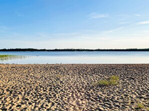 A beach with a clear sky and calm water. - 3 Person Holiday Home in Ljungby (Ljungby)
