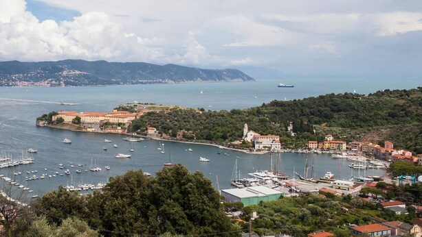 A coastal town with a marina filled with boats, surrounded by hills and buildings. - Quiet and secluded, close to Cinque Terre, Porto Venere, Lerici, and Tellaro (Le Grazie)