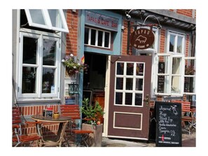 Experience the authentic charm of Tapas & Cafe Bar, where traditional meets casual dining.