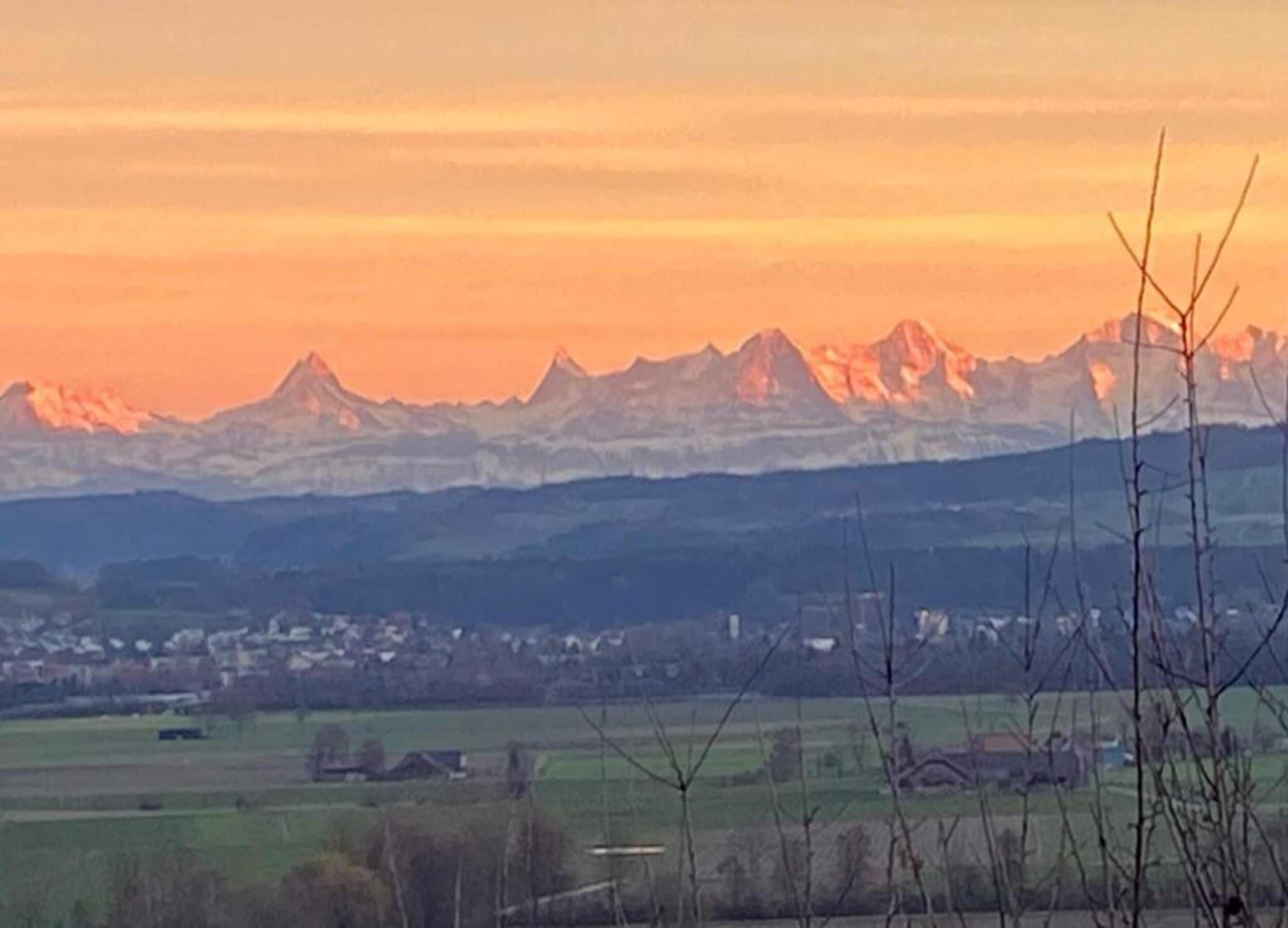 A mountainous landscape with a town in the valley.