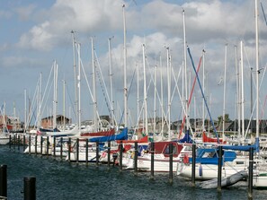 A marina with multiple boats docked at wooden piers. - 8 Person Holiday Park Home in Bogense (Bogense)