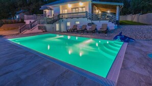 A house with a swimming pool, a covered patio, and a staircase leading to the main entrance. - Apartment in Croatia Near the Adriatic Coast (Vinodol)