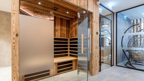 A modern interior with a wooden panel wall, a glass partition, and a metal spiral structure. - Modern Holiday Apartment With Balcony (Fuegen)