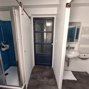 Shower, hair dryer, towels, soap