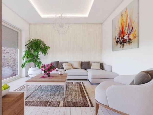 A modern living room with a sofa, a coffee table, a potted plant, and a painting on the wall.