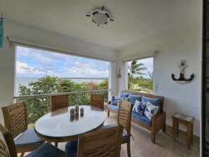 Outdoor dining - Playa Dorada: Cozy family friendly beachfront 3 bedroom /3 bathroom apartment. (Puerto Plata)