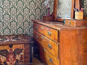 A wooden dresser with multiple drawers and a mirror. - 4 Person Holiday Home in Hoje (Höje)