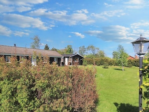 A residential property with a house, a lawn, and a lamp post. - 6 Person Holiday Home in Rodvig Stevns (Rodvig Stevns)