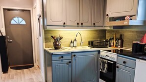 A kitchen with a sink, stove, and cabinets. - 5 Person Holiday Home in Falkenberg (Falkenberg)