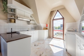 Apartamento | Cozinha privada | Chaleira elétrica, torradeira