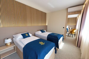 Family Room, 2 Bedrooms | In-room safe, desk, laptop workspace, free WiFi