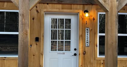 Cozy cabin rental located on the atv & snowmobile trail. Family & Pet friendly