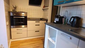 Apartment | Private kitchen | Oven, electric kettle, toaster