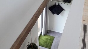 A staircase with wooden steps leading to a landing. - Lovely Apartment in Rettenberg (St Andra-Hoech)