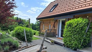 A wooden house with a sloped roof and a small window. - Lovely Apartment in Rettenberg (St Andra-Hoech)