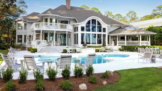 A large house with a swimming pool, multiple decks, and outdoor seating areas. - 21 Painted Bunting at The Sea Pines Resort (Hilton Head Island)