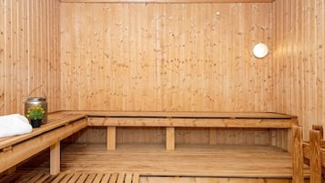 A sauna with wooden walls and benches.