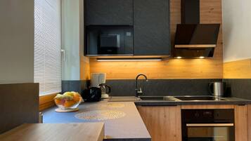Apartment | Private kitchen | Oven, electric kettle, toaster, cookware/dishes/utensils