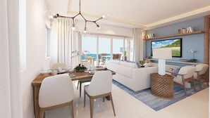 A modern living room with a dining area, a sofa, a TV, and a view of the sea.