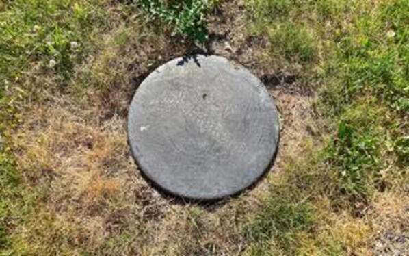 A circular stone structure on grass. - 6 Person Holiday Home in Stubbekobing (Stubbekobing)