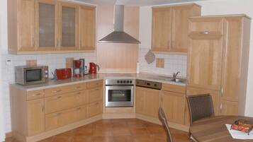 Apartment | Private kitchen | Oven, electric kettle, toaster