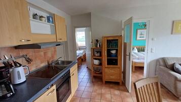 Apartment | Private kitchen | Electric kettle, high chair