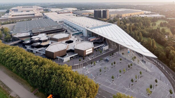 A large industrial complex with multiple buildings, parking areas, and a prominent curved roof structure. - Cosy Apartment in Oberhausen With Balcony (Oberhausen)