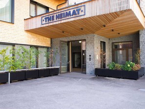 Welcome to The Heimat, a stylish building with a unique blend of natural elements.