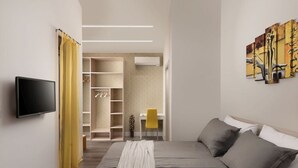 A modern bedroom with a bed, a TV, a wardrobe, and a desk.