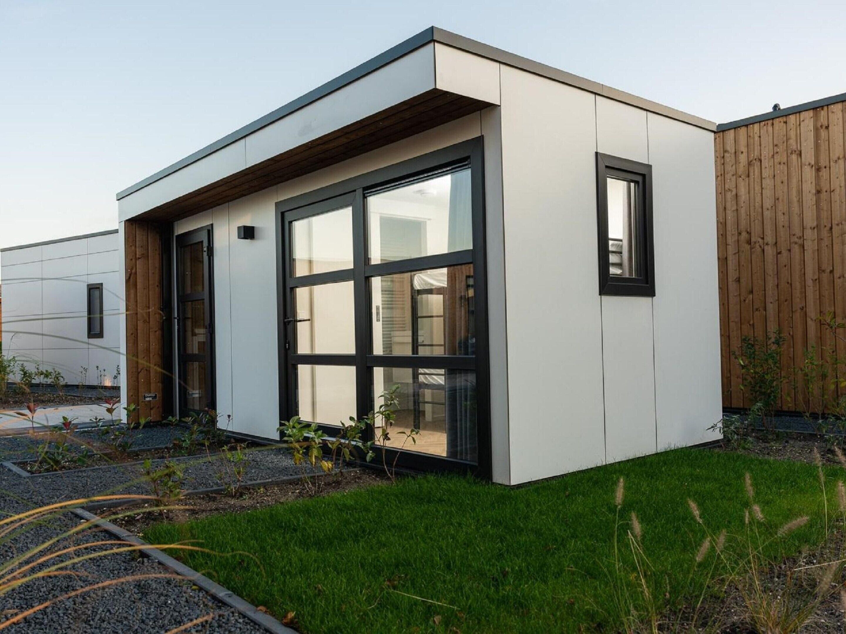 A modern building with large windows and a flat roof.