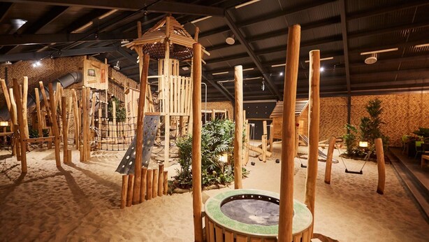 An indoor play area with wooden structures and a sandpit. - Luxurious Holiday Home With Sauna in Limburg (Roggel)