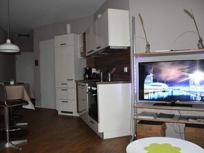 Apartamento | Cozinha privada | Fogão, cadeirão de bebê