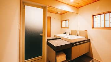 Deep soaking tub, rainfall showerhead, hair dryer, towels