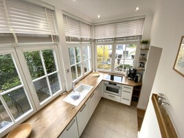 Apartamento | Cocina privada | Horno, tostadora y trona infantil