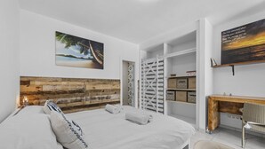A hotel room with a bed, a desk, and a chair. - "Oasis" Apartment in Playa Blanca | Lanzarote - Spain (Playa Blanca)