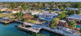 Tropical oasis on the water. Heated pool w. lots of family amenities & games