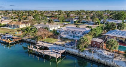 Tropical oasis on the water. Heated pool w. lots of family amenities & games