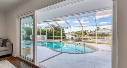 Tropical oasis on the water. Heated pool w. lots of family amenities & games